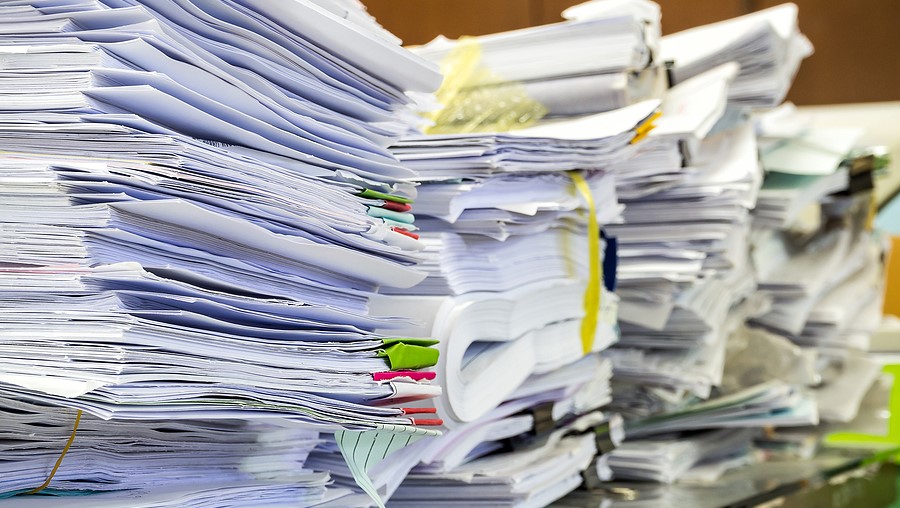 Closeup photo of business documents stacked on a desk